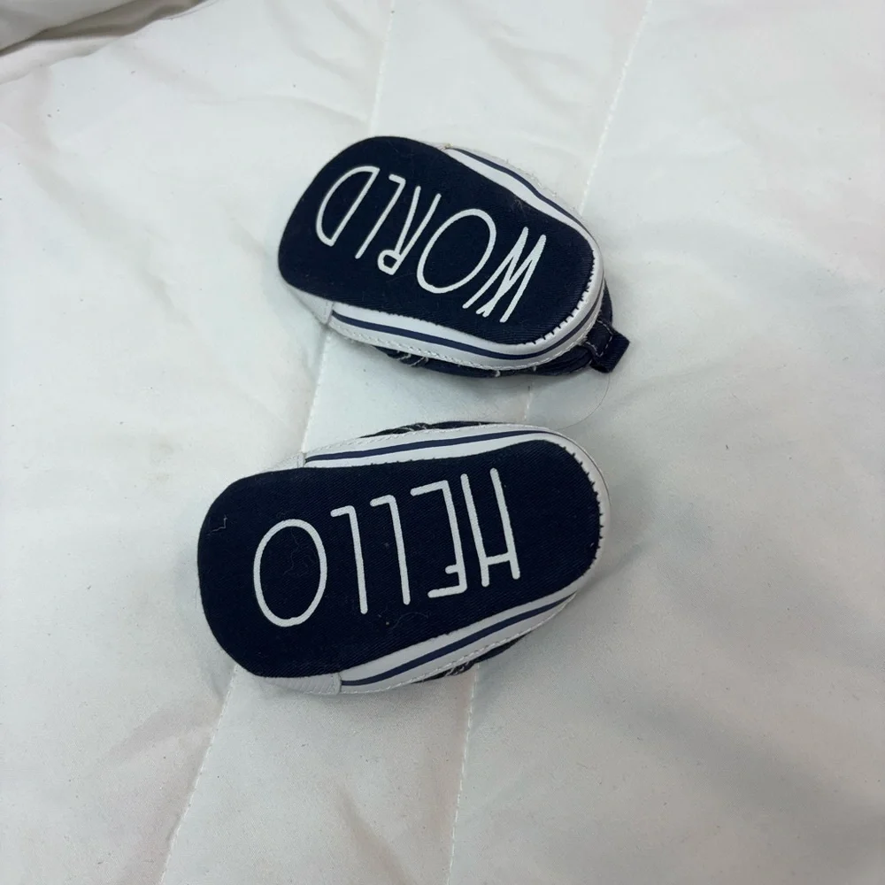 NWOT. Classic Navy Baby Slip-On Shoes 3-6 months- bottoms say Hello World